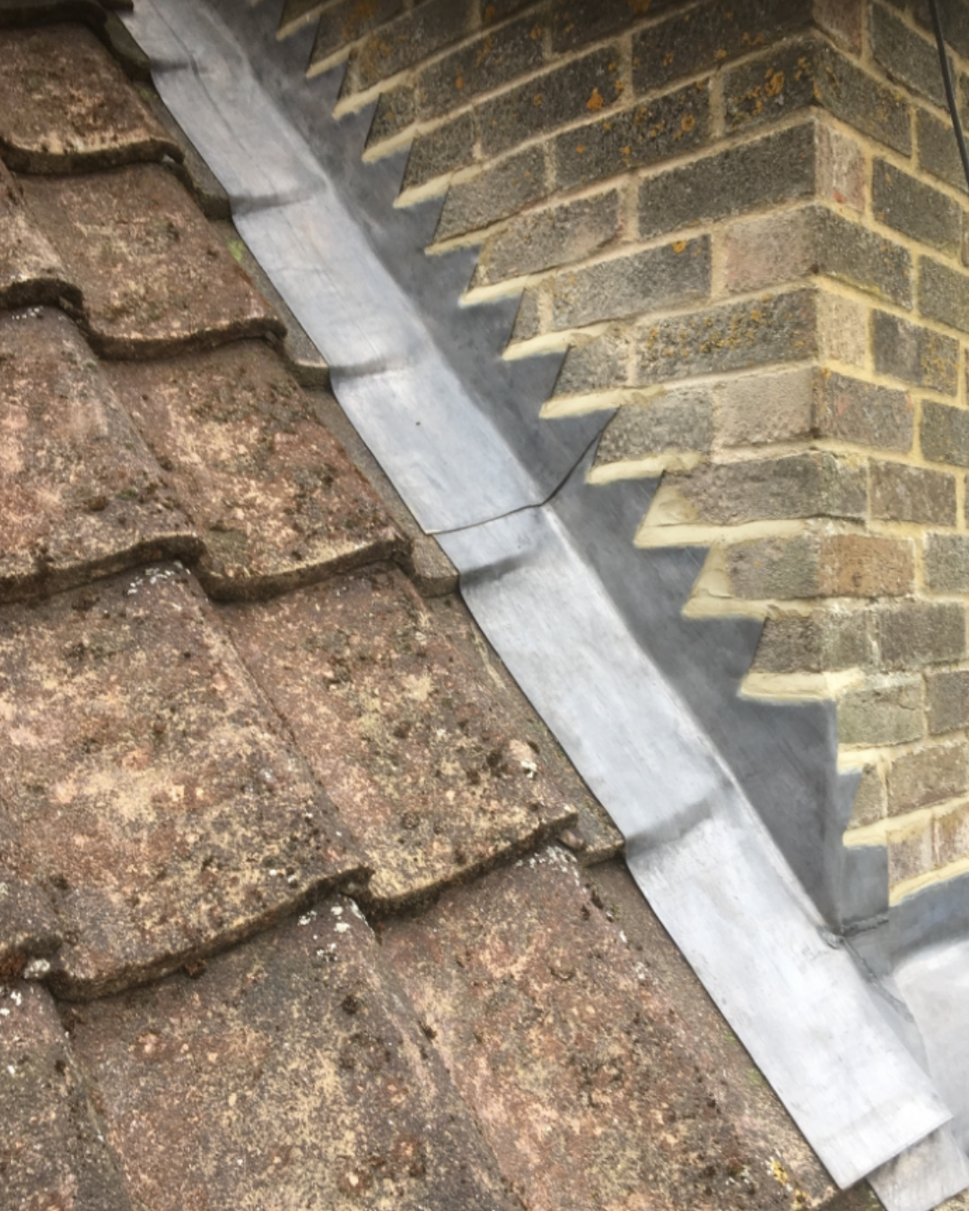 New lead flashings and step flashings to a chimney stack