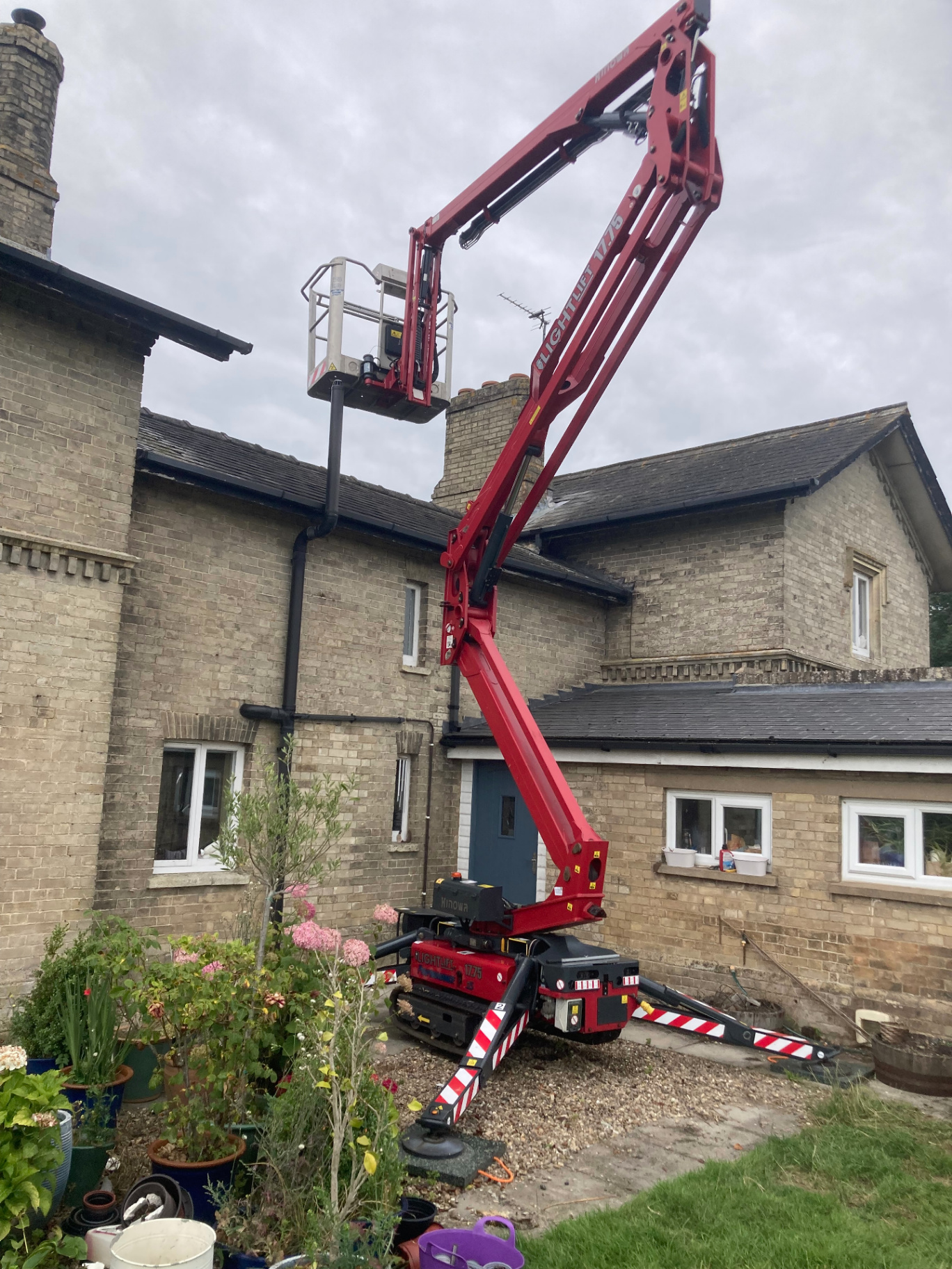 Hinowa tracked cherry picker in use accessing a chimney